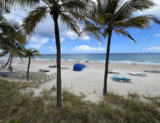 a lobby with furniture and a potted plant