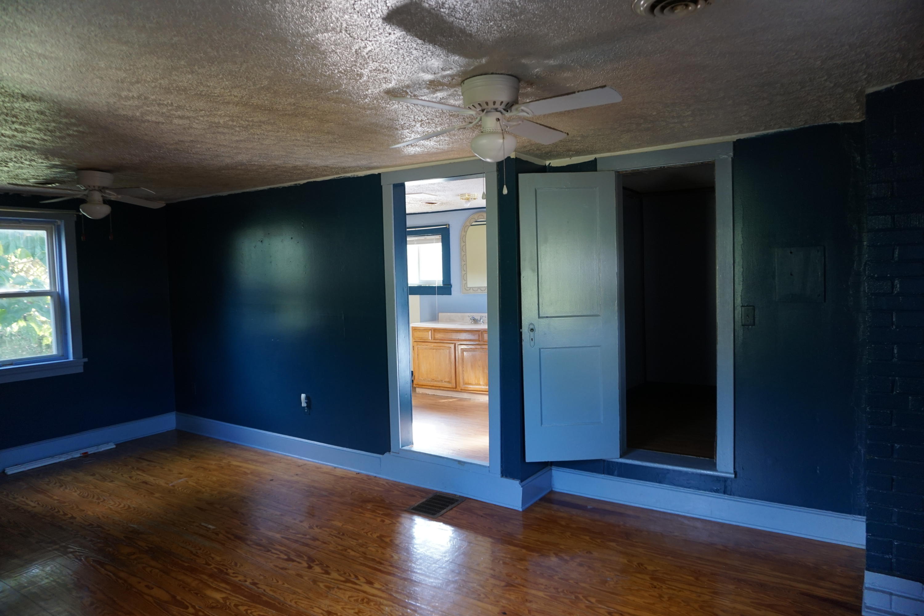 2932 Webster Road Blue Ridge, VA 24064 - Photo 14 of 17 an empty room with wooden floor and windows
