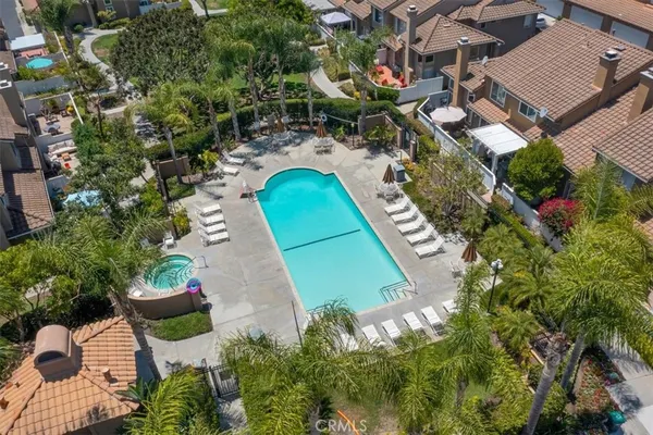 an aerial view of residential houses with outdoor space