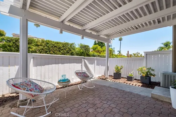a view of a chairs and table in the patio