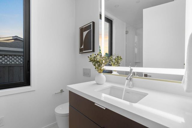 a bathroom with a glass shower door