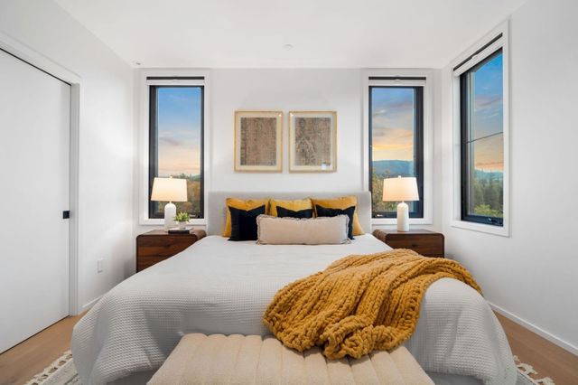 a bathroom with a double vanity sink mirror and shower