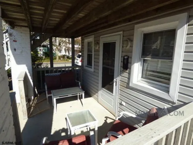 a view of a porch with furniture