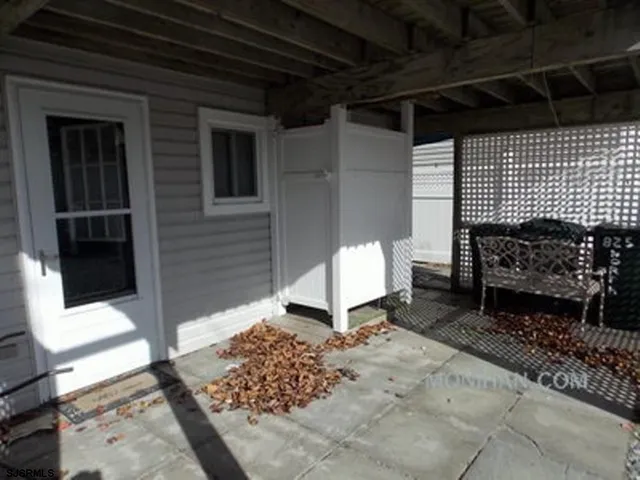 a bench in front of house