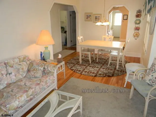 a spacious bathroom with a granite countertop sink and a mirror