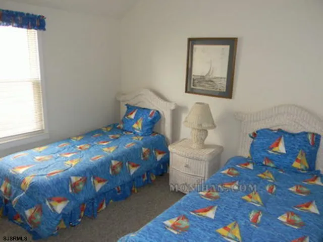 a bathroom with a shower and a bath tub