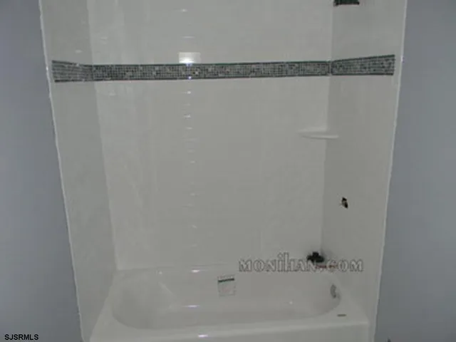 a view of a chair and tables in the balcony