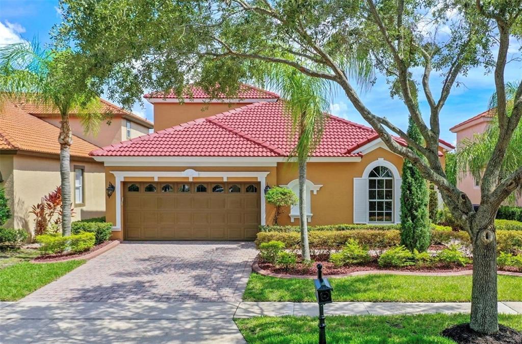 11520 Via Lucerna Circle Windermere, FL 34786 - Photo 1 of 1 a front view of a house with a yard and garage
