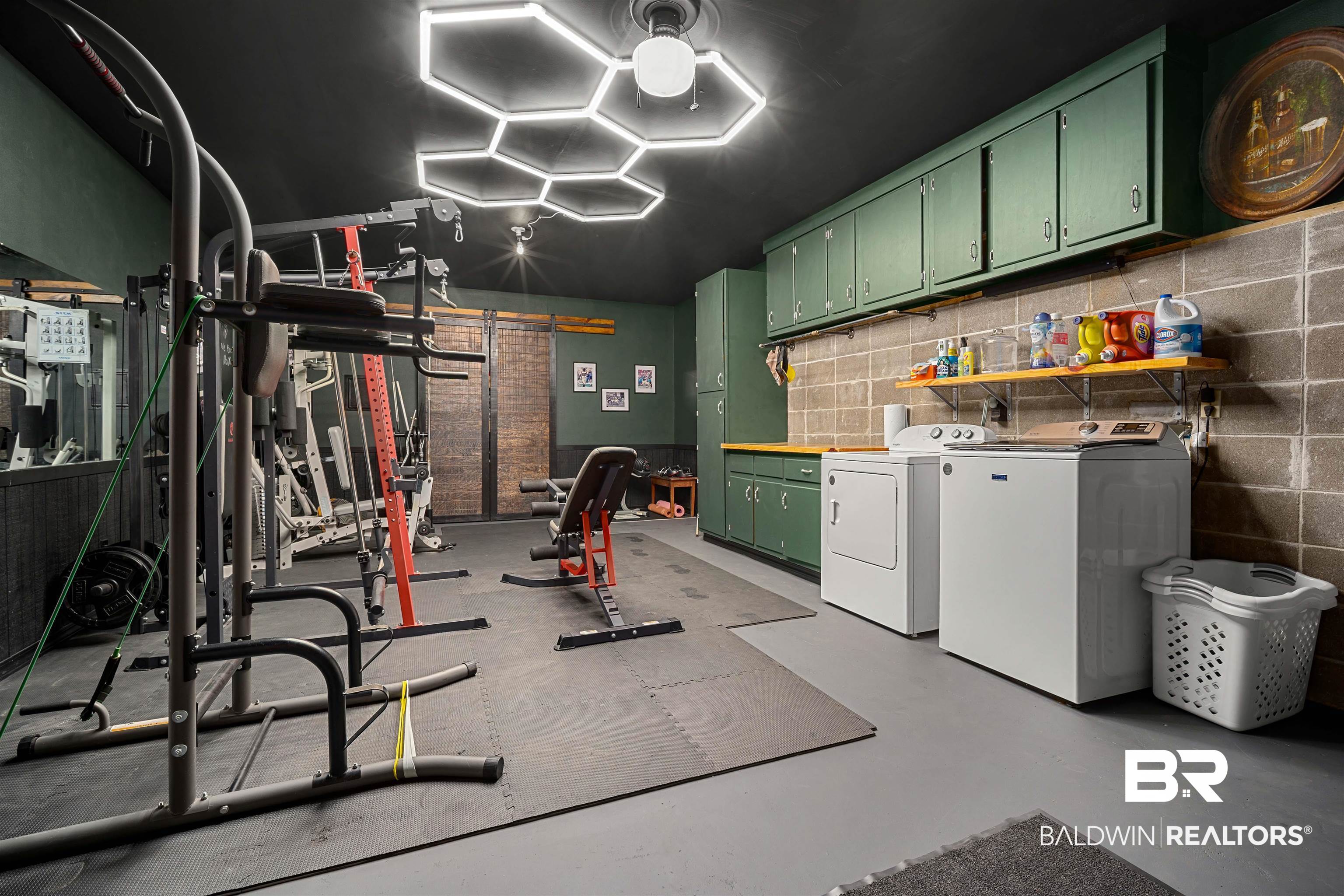 71 Caisson Trace Daphne, AL 36527 - Photo 33 of 36 Dedicated fitness and utility space featuring a dark ceiling, hexagon-shaped LED lighting, and rubber mat flooring