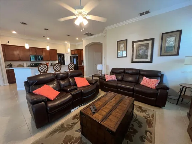 a view of a livingroom with furniture and a window
