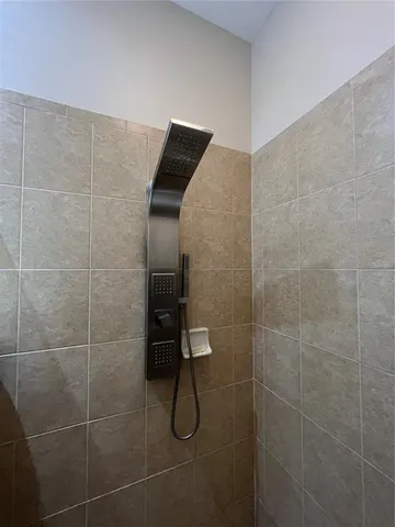 a bedroom with two beds and a closet