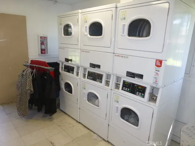 a view of an empty room and staircase