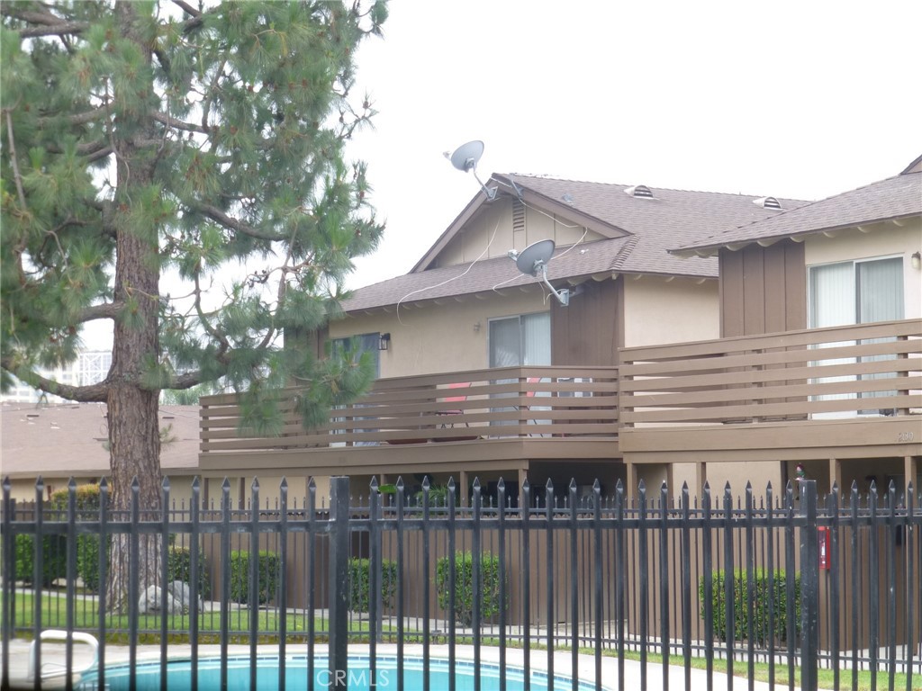 2134 South Acama Street Anaheim, CA 92802 - Photo 2 of 38 a view of a house with a wooden fence