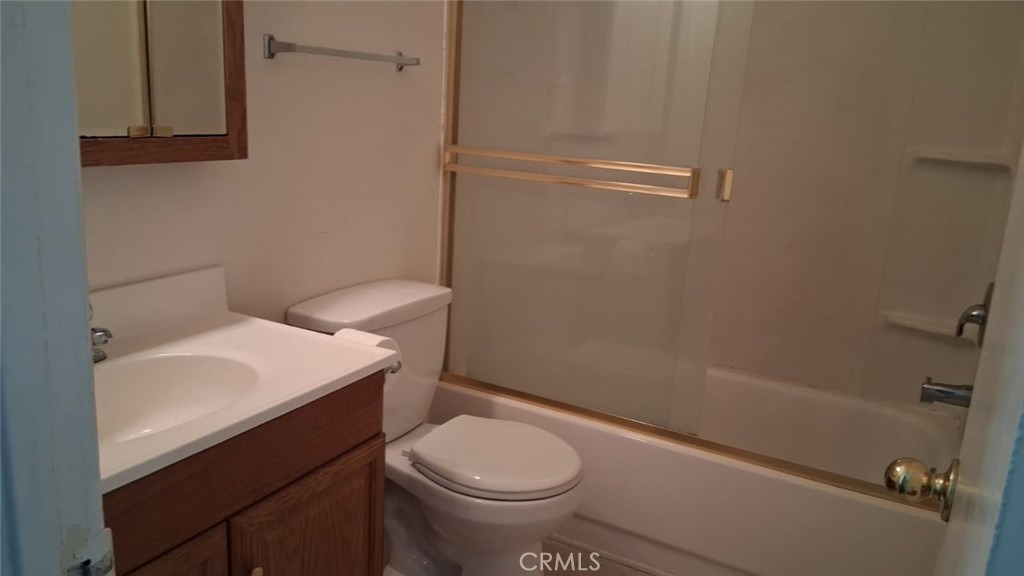 2134 South Acama Street Anaheim, CA 92802 - Photo 31 of 38 a bathroom with a sink a toilet and shower