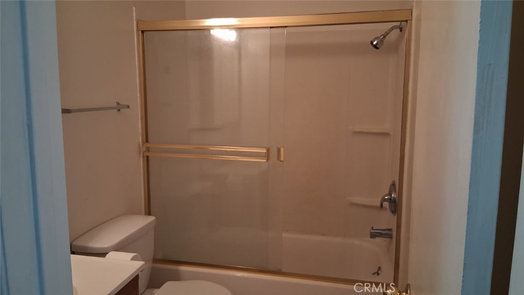 2134 South Acama Street Anaheim, CA 92802 - Photo 37 of 38 a bathroom with a shower and toilet