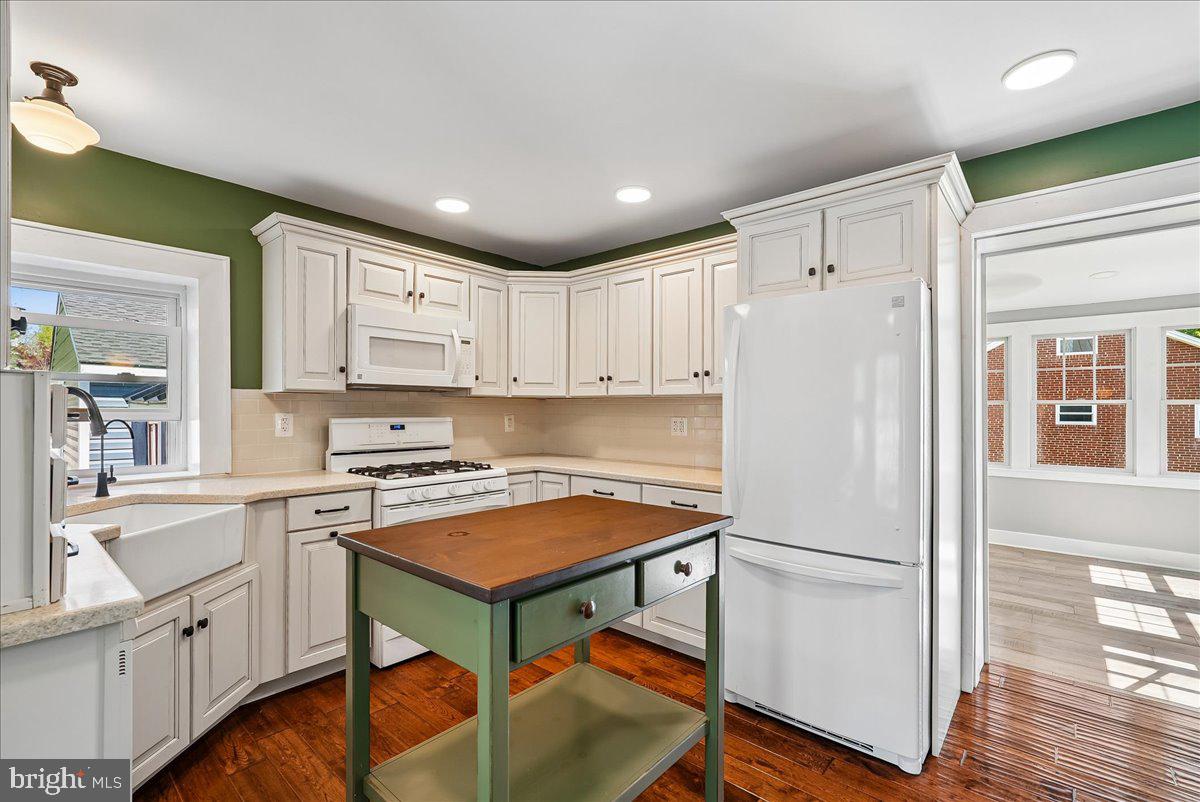 209 Rice Street Berryville, VA 22611 - Photo 17 of 67 Kitchen with island opens to sunroom