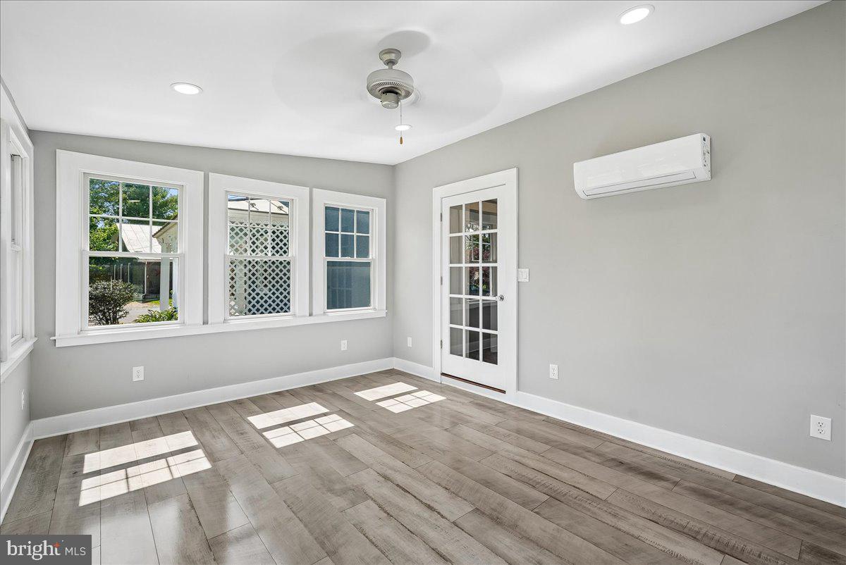 209 Rice Street Berryville, VA 22611 - Photo 18 of 67 Sunroom off Kitchen w/split system, LVP flooring