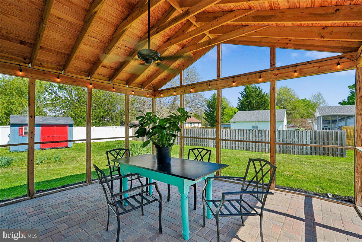 209 Rice Street Berryville, VA 22611 - Photo 45 of 71 Screen porch with vaulted ceiling and brick patio