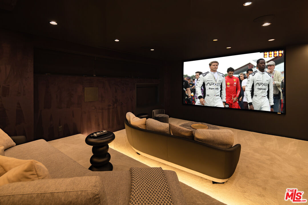 9705 Oak Pass Road Beverly Hills, CA 90210 - Photo 17 of 22 a living room with furniture and a rug