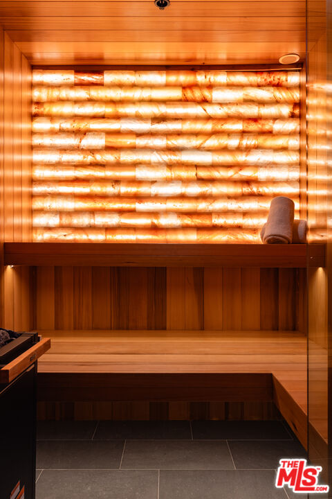 9705 Oak Pass Road Beverly Hills, CA 90210 - Photo 19 of 22 a bathroom with a sink and a window