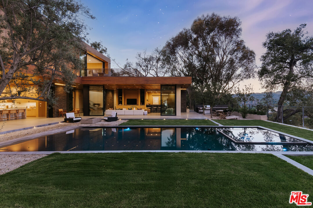 9705 Oak Pass Road Beverly Hills, CA 90210 - Photo 20 of 22 a view of a house with pool table and chairs