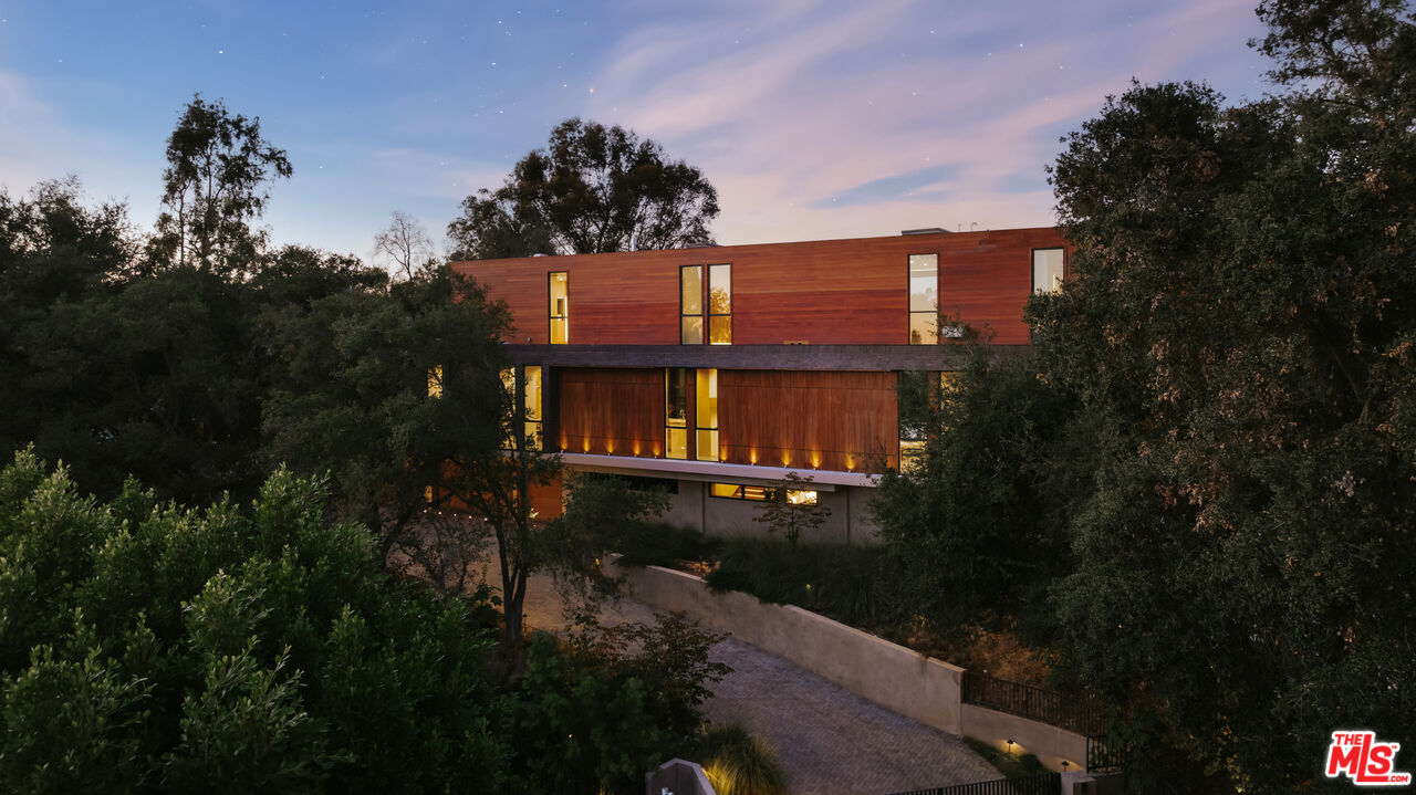9705 Oak Pass Road Beverly Hills, CA 90210 - Photo 22 of 22 a view of a house with a yard balcony and tree s