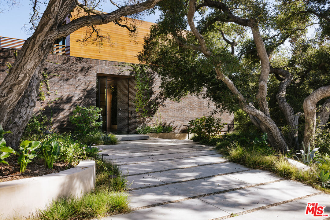 9705 Oak Pass Road Beverly Hills, CA 90210 - Photo 3 of 22 a view of backyard of house