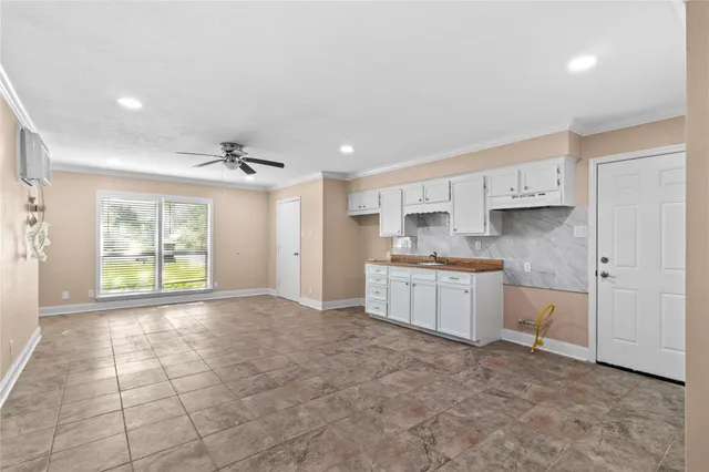 a kitchen with a refrigerator and window