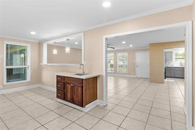 a spacious bathroom with a vanity a mirror and a shower