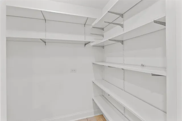a view of an empty walk in closet