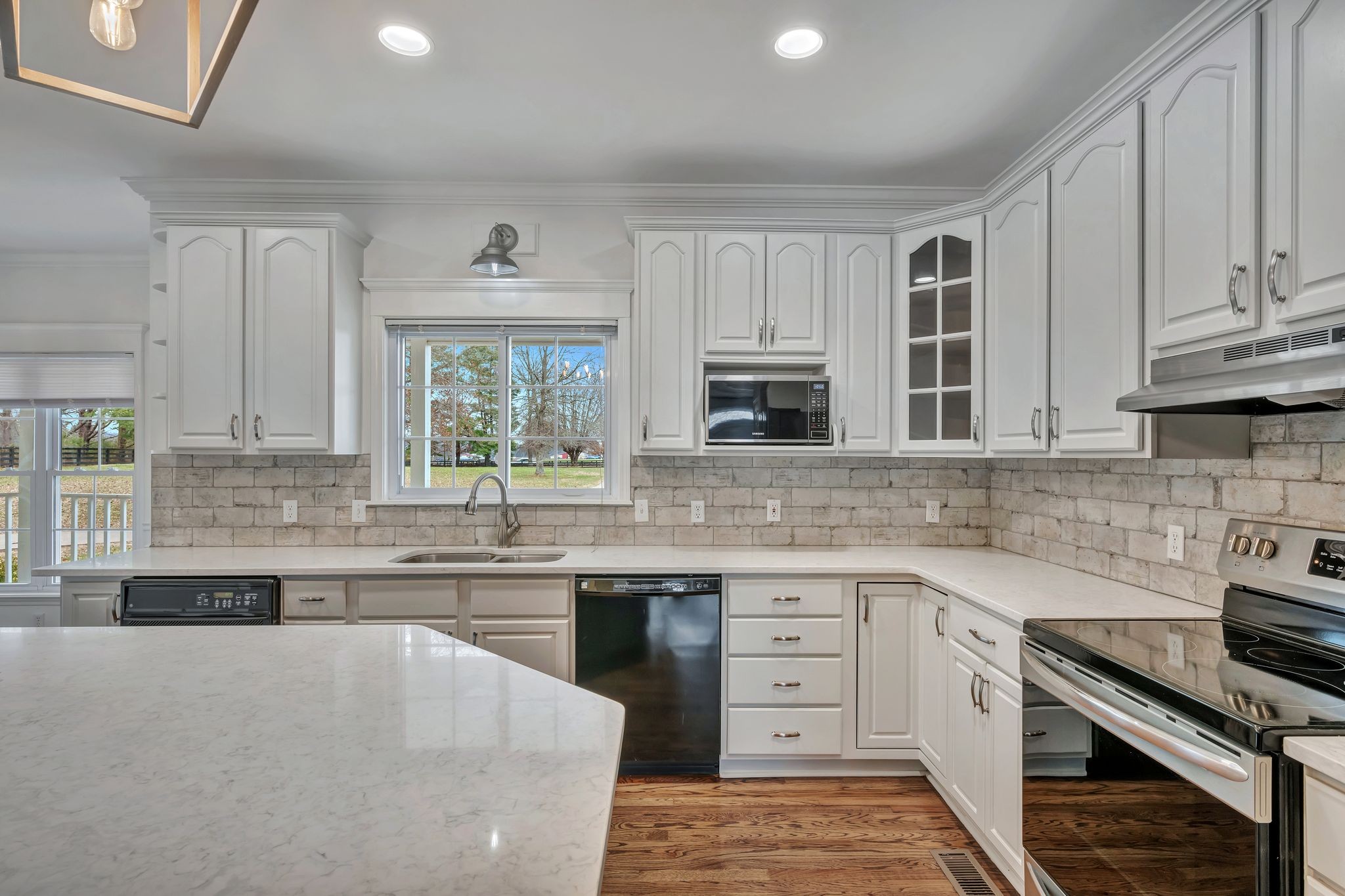 1576 Old Hillsboro Road Franklin, TN 37069 - Photo 13 of 57 a kitchen with stainless steel appliances a stove sink and cabinets
