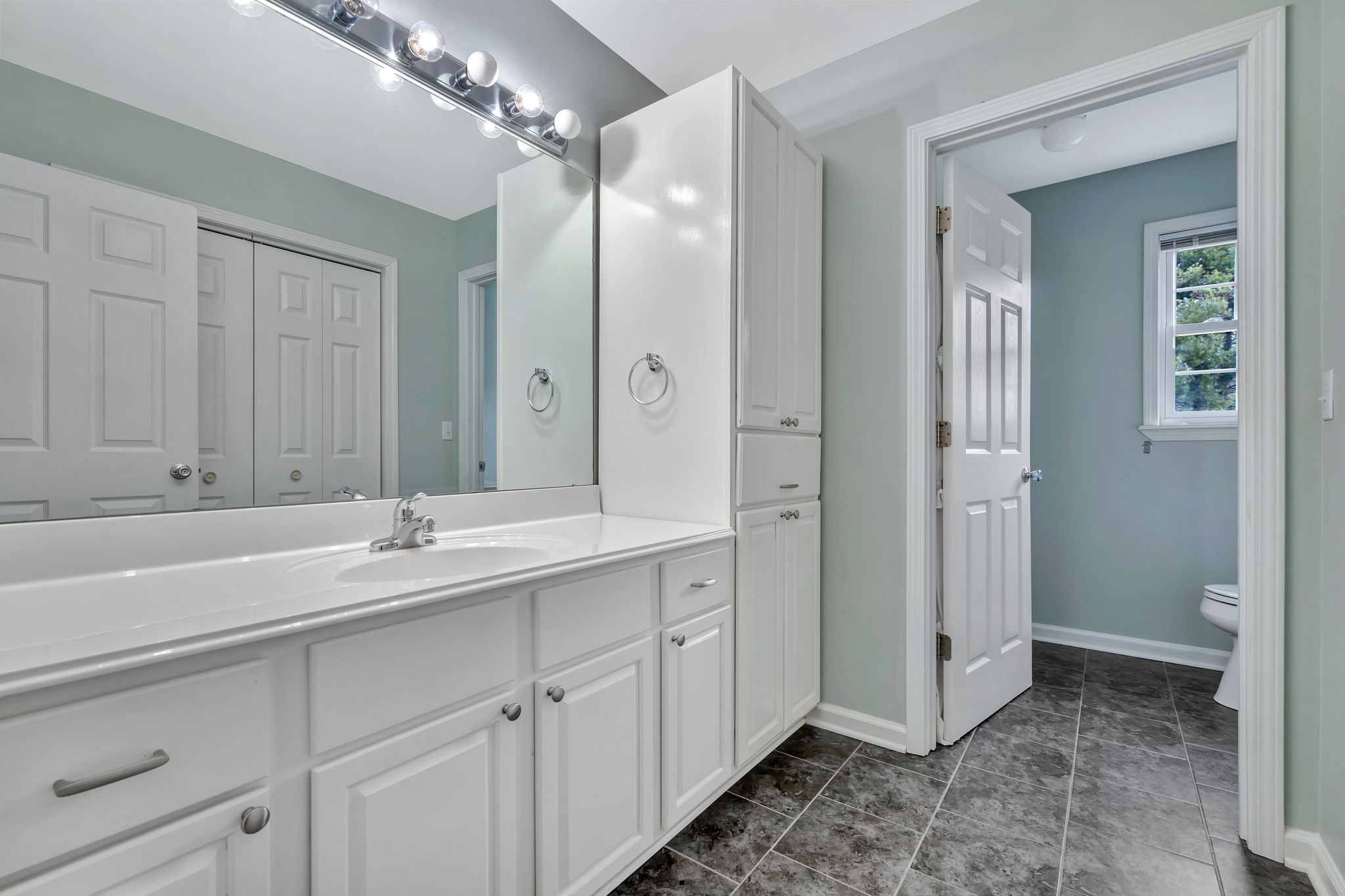 1576 Old Hillsboro Road Franklin, TN 37069 - Photo 35 of 57 a bathroom with a double vanity sink and mirror