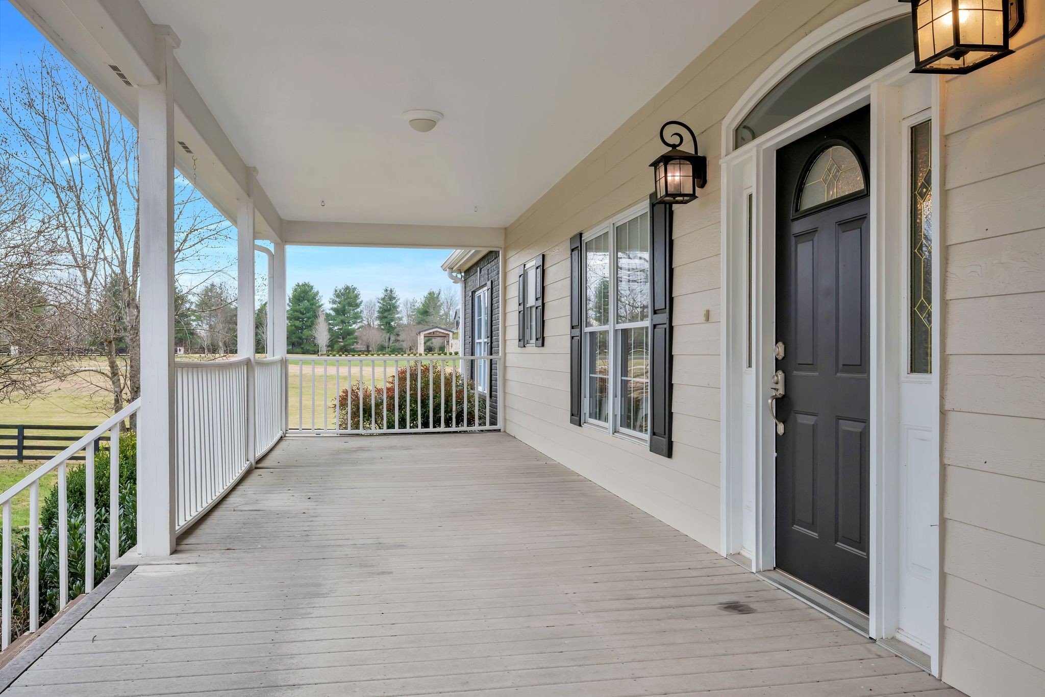 1576 Old Hillsboro Road Franklin, TN 37069 - Photo 4 of 57 a view of a porch with wooden floor and stairs