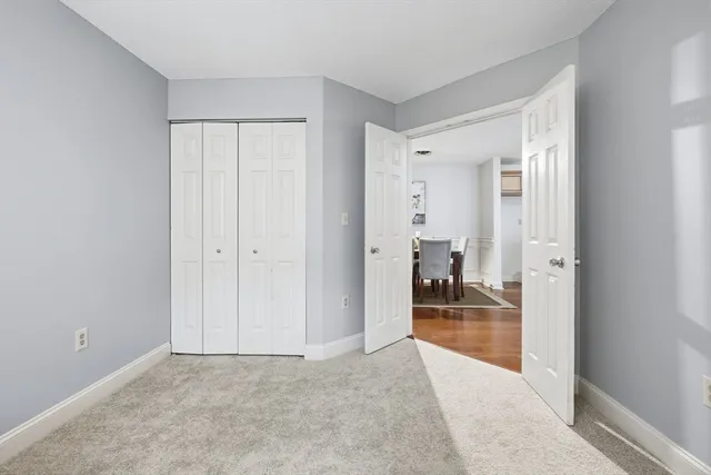 a hallway with a couch and chandelier