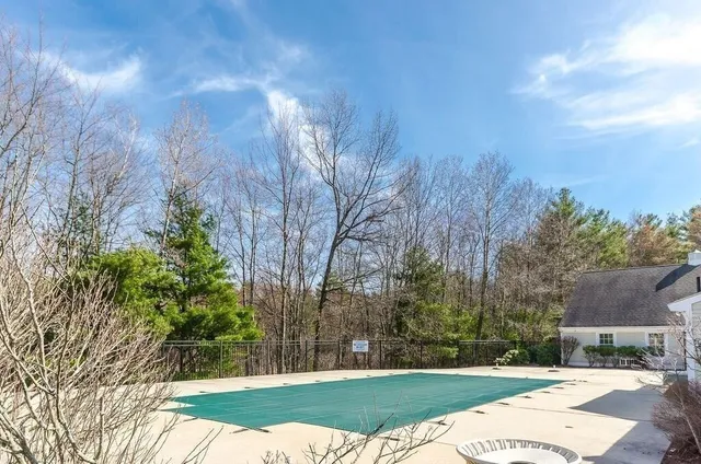 a view of a backyard with a small pool