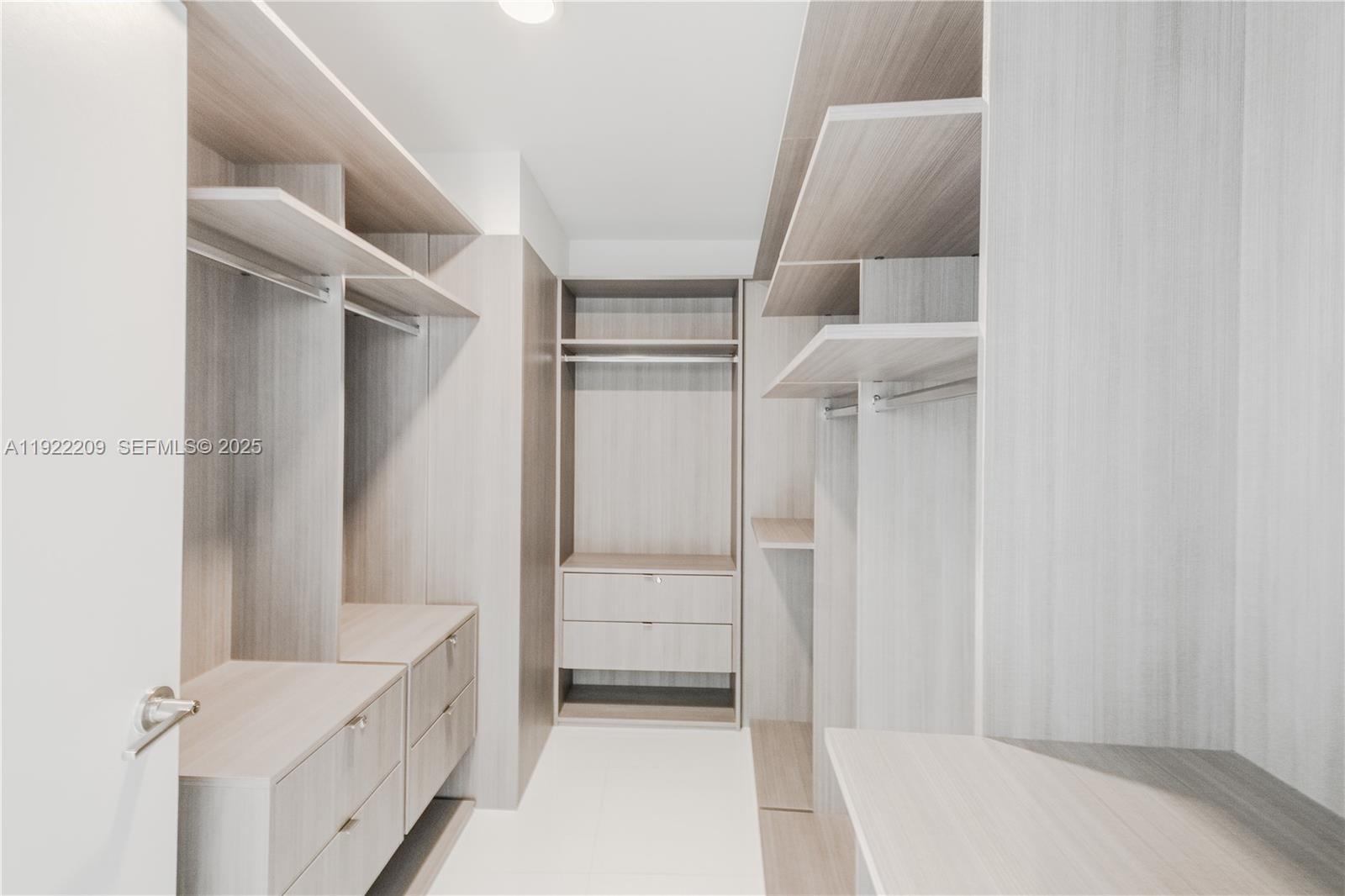 851 Northeast 1st Avenue, Unit 3911 Miami, FL 33132 - Photo 22 of 75 a view of walk in closet