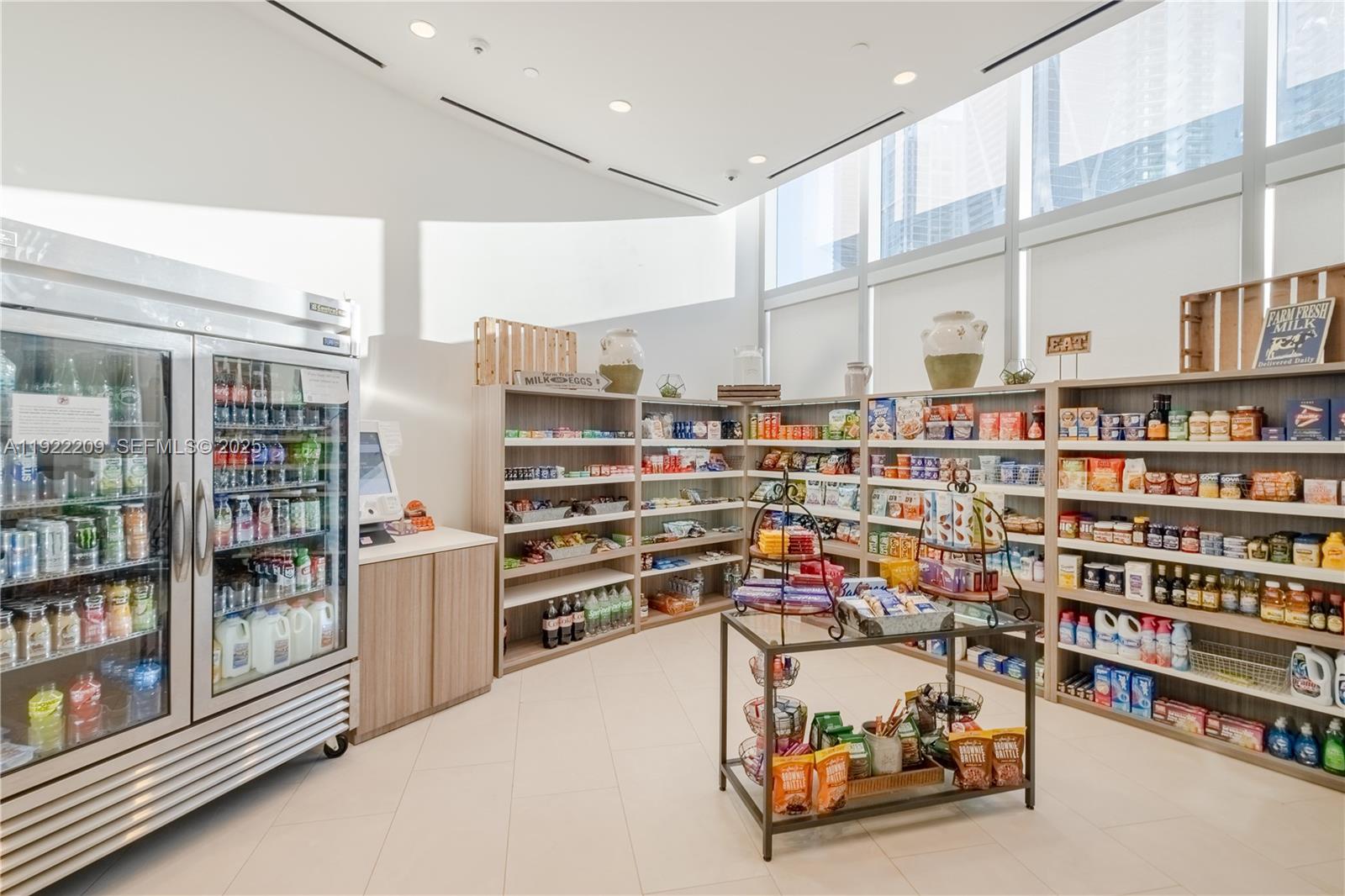 851 Northeast 1st Avenue, Unit 3911 Miami, FL 33132 - Photo 49 of 75 a room with lots of furniture and white walls