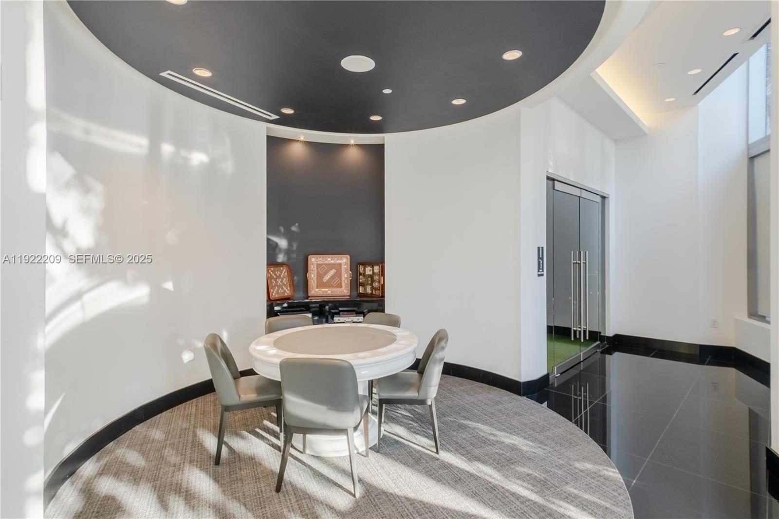 851 Northeast 1st Avenue, Unit 3911 Miami, FL 33132 - Photo 51 of 75 a dining room with furniture and wooden floor