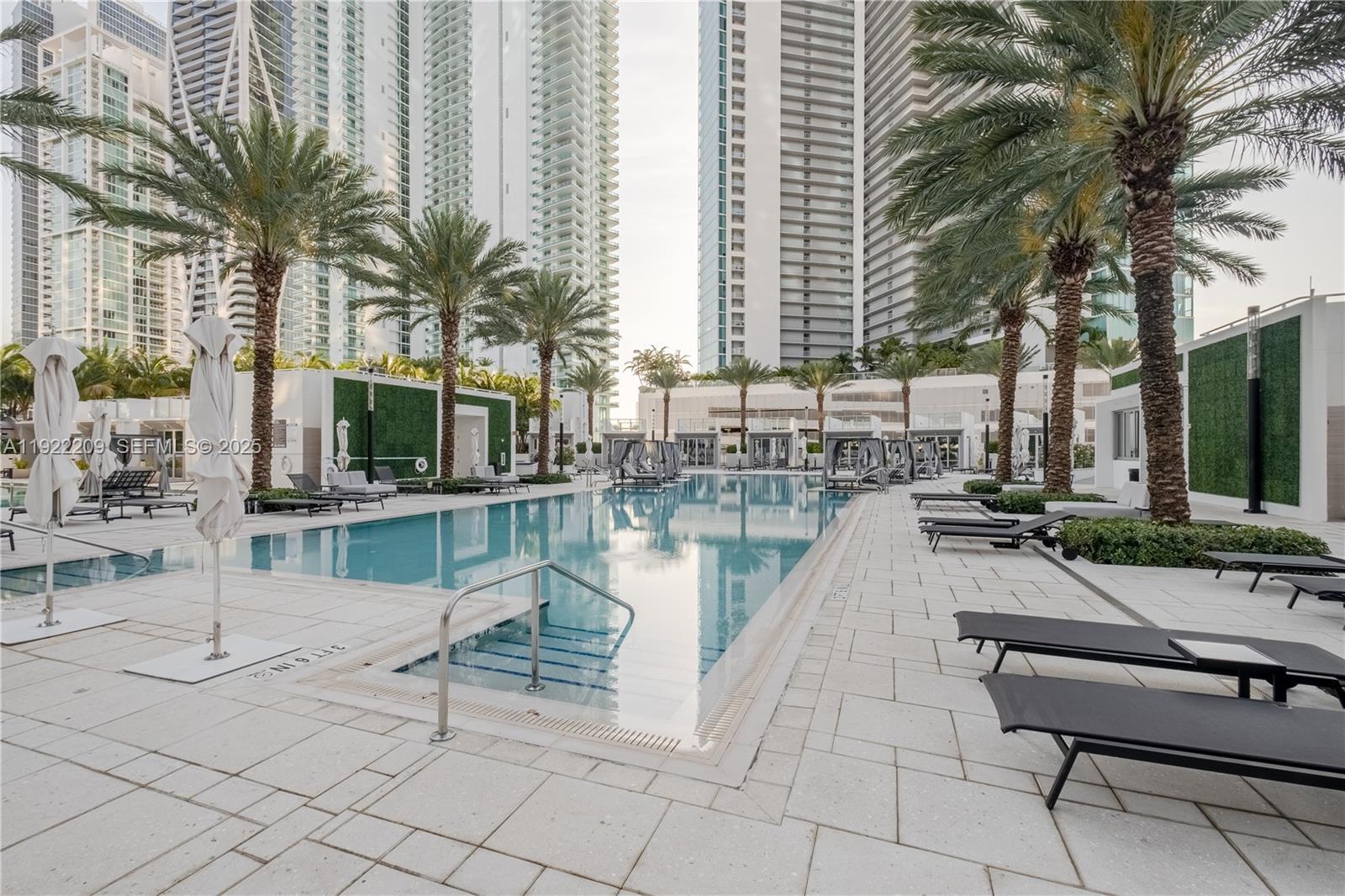 851 Northeast 1st Avenue, Unit 3911 Miami, FL 33132 - Photo 56 of 75 a swimming pool with outdoor seating and patio