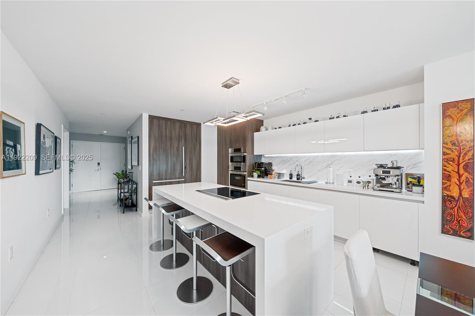 851 Northeast 1st Avenue, Unit 3911 Miami, FL 33132 - Photo 6 of 75 a kitchen with stainless steel appliances a sink stove and refrigerator
