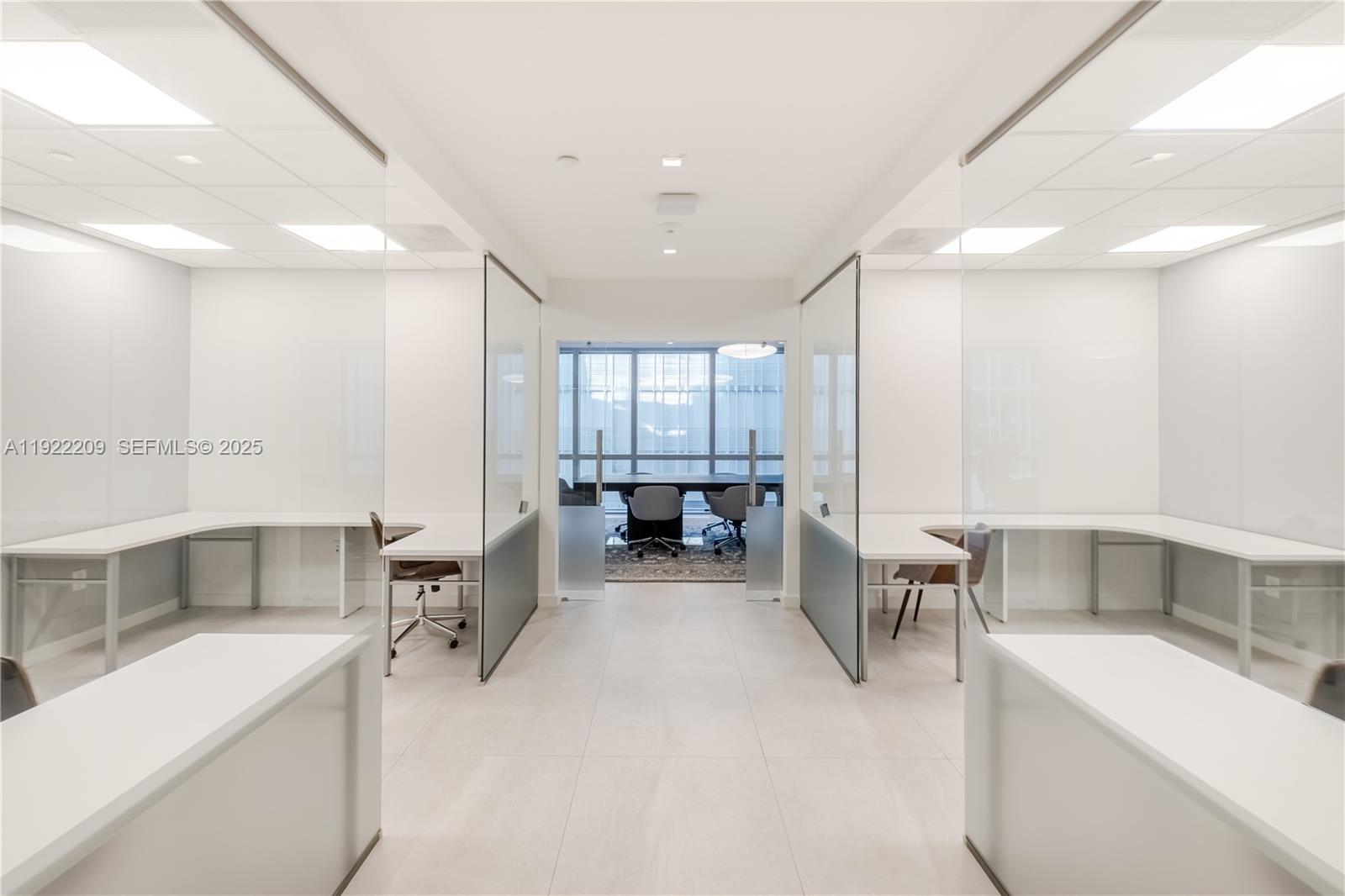 851 Northeast 1st Avenue, Unit 3911 Miami, FL 33132 - Photo 67 of 75 a large white kitchen with a large window and furniture