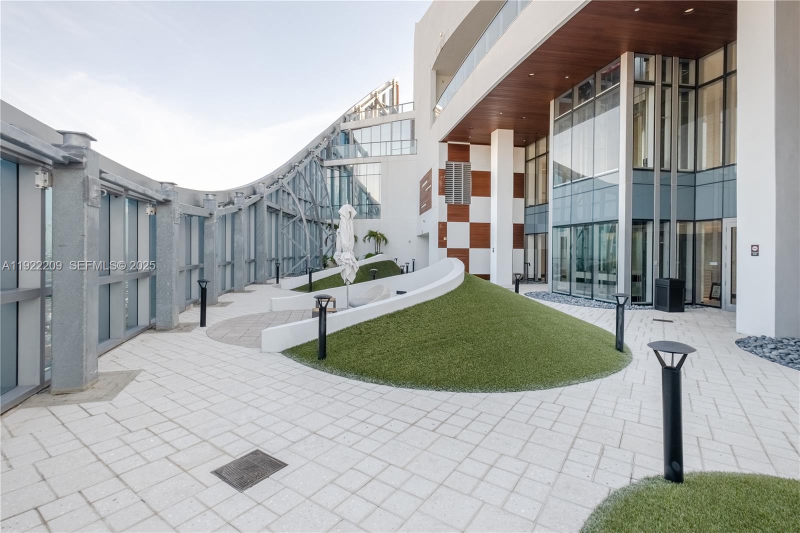851 Northeast 1st Avenue, Unit 3911 Miami, FL 33132 - Photo 72 of 75 a front view of a house with a garden