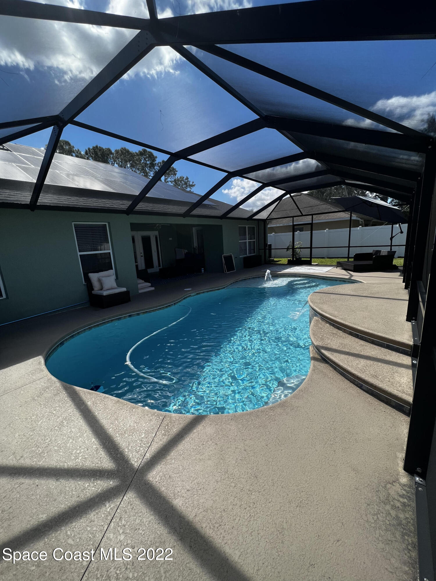 1099 Flagami Road Southeast Palm Bay, FL 32909 - Photo 22 of 28 Screened heatet Pool