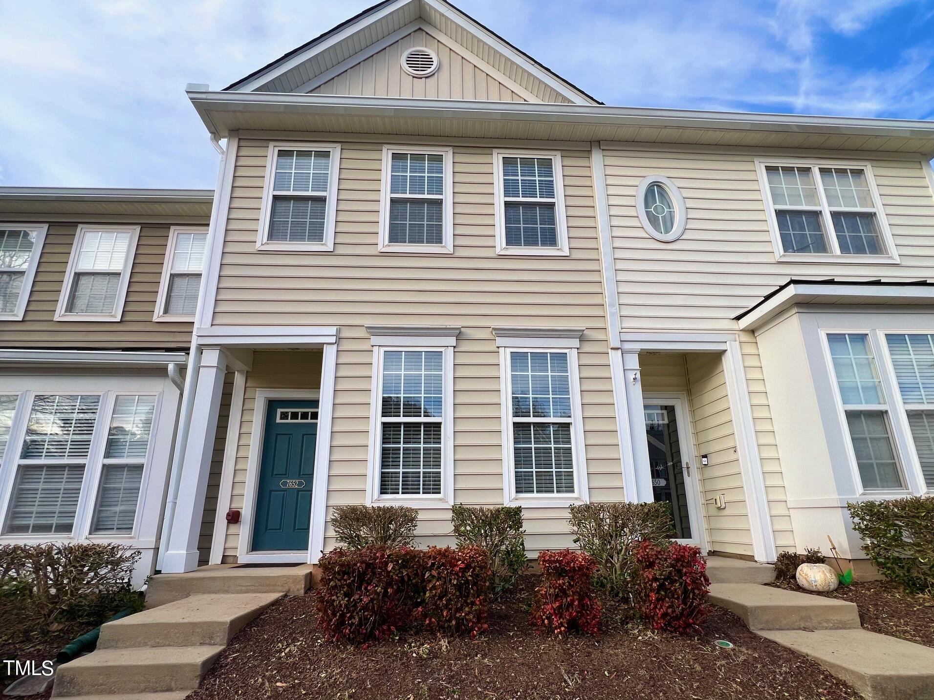 7652 Winners Edge Street Raleigh, NC 27617 - Photo 1 of 16 a front view of a house with a yard