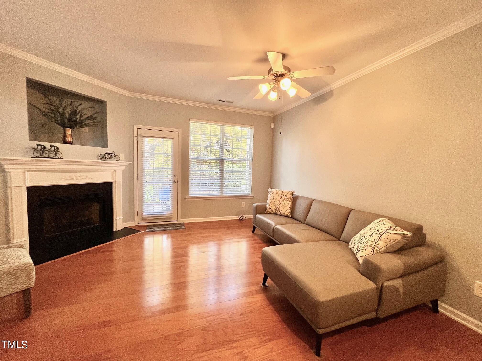 7652 Winners Edge Street Raleigh, NC 27617 - Photo 3 of 16 a living room with furniture and a fireplace