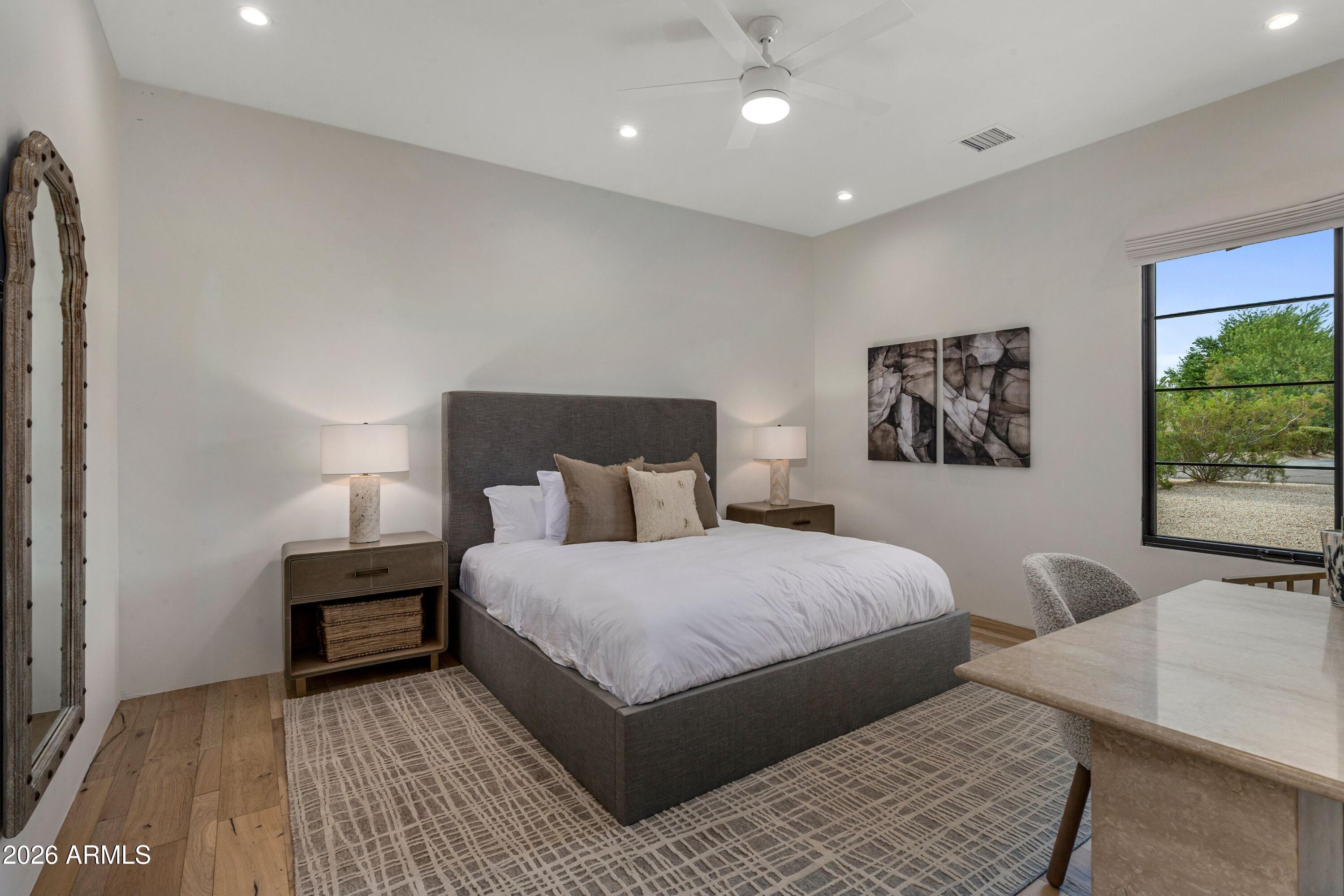 8307 East Gary Road Scottsdale, AZ 85260 - Photo 25 of 34 a bedroom with a bed and a couch