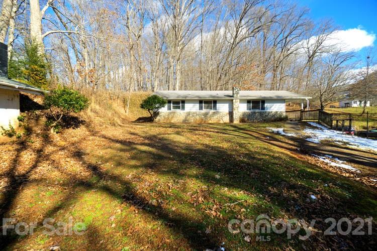 4904 Crabtree Mountain Road Clyde, NC 28721 - Photo 1 of 37 a view of a house with a yard