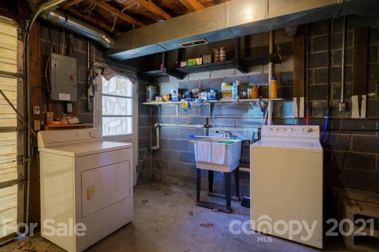 4904 Crabtree Mountain Road Clyde, NC 28721 - Photo 13 of 37 a utility room with dryer and washer