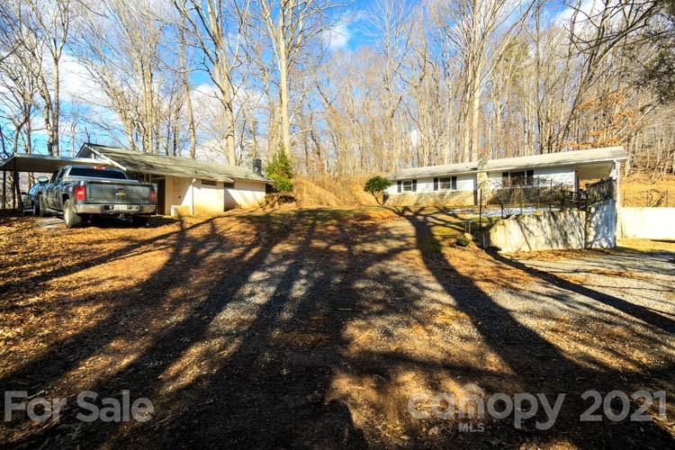 4904 Crabtree Mountain Road Clyde, NC 28721 - Photo 23 of 37 a view of a yard with cars