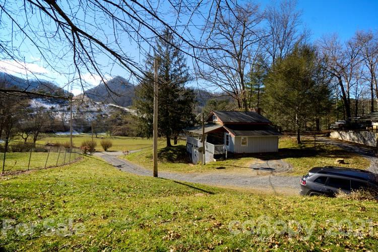 4904 Crabtree Mountain Road Clyde, NC 28721 - Photo 30 of 37 a view of a yard with a house